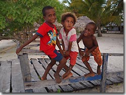 Kids playing- diving from the Arenui at Raja Ampat, West-Papua, Indonesia.